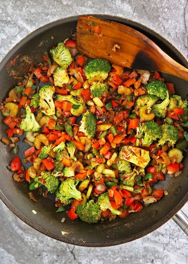 Sautéing veggies to make a holiday quinoa salad