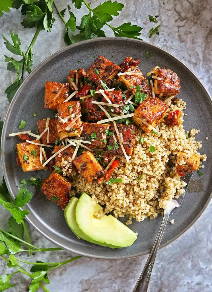 This Marry Me Tofu Dinner is a Vegan version of marry me chicken - served in a  a plate with quinoa.