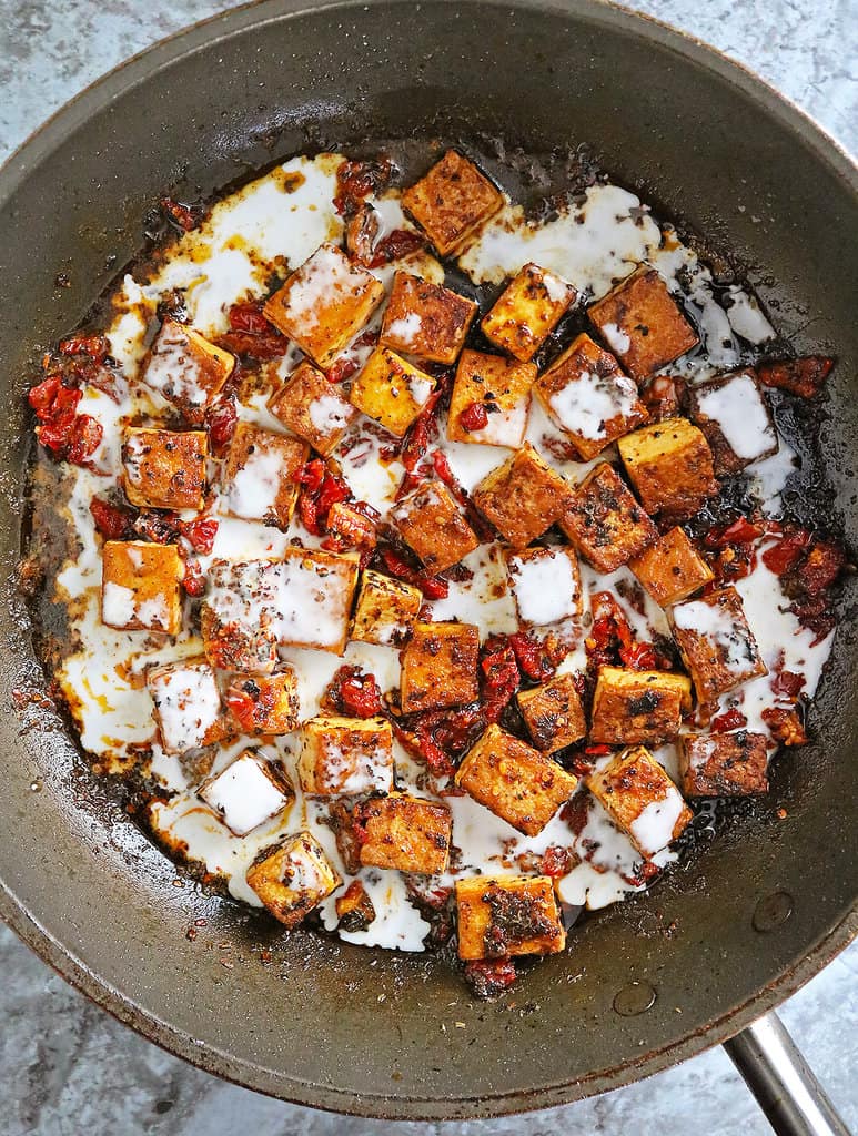 Spiced tofu with sundried tomatoes and creamy coconut sauce