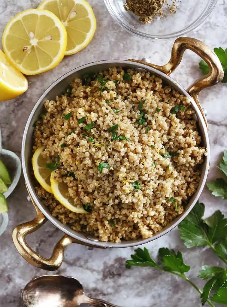 Tasty lemon za'atar quinoa side dish served in a gold rimmed pan