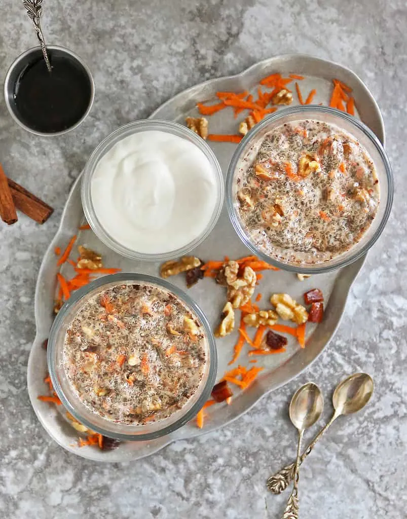 Healthy easy carrot cake pudding in two bowls on a silver tray
