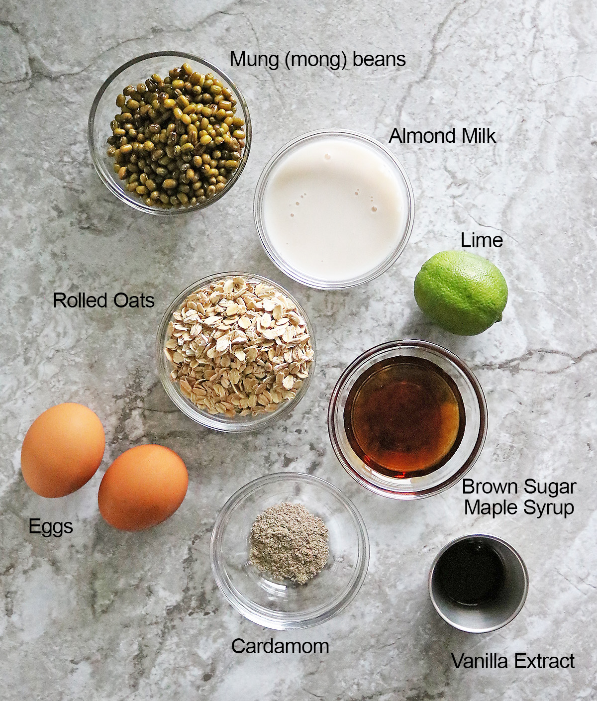 Ingredients to make mung bean oatmeal bake on a gray background