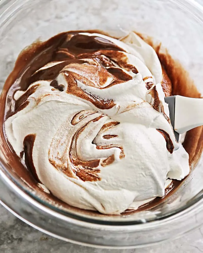 Mixing melted chocolate with cool whip