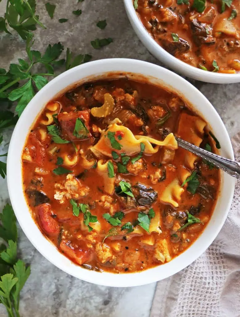 My favorite chicken lasagna soup in a large bowl.