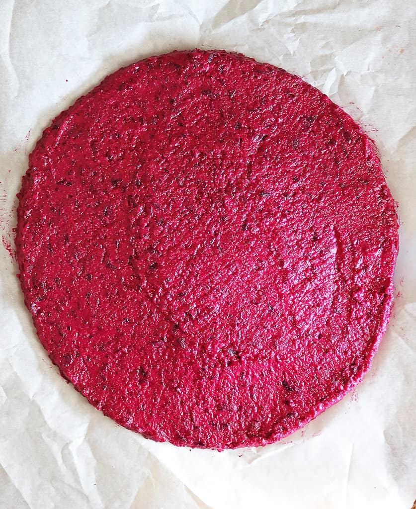 Beet crust pizza ready to bake.
