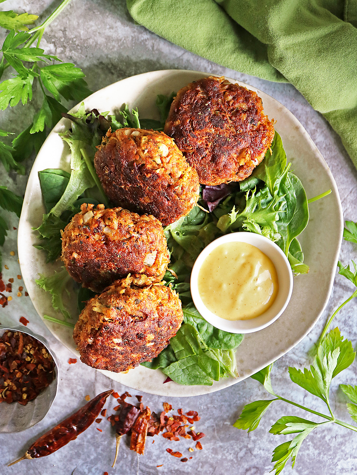 Tasty chicken cakes on a bed of greens