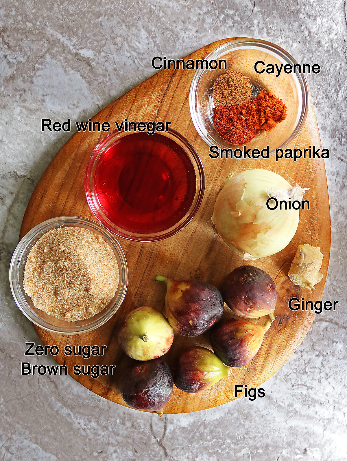 The ingredients needed to make fig chutney laid on a cutting board.