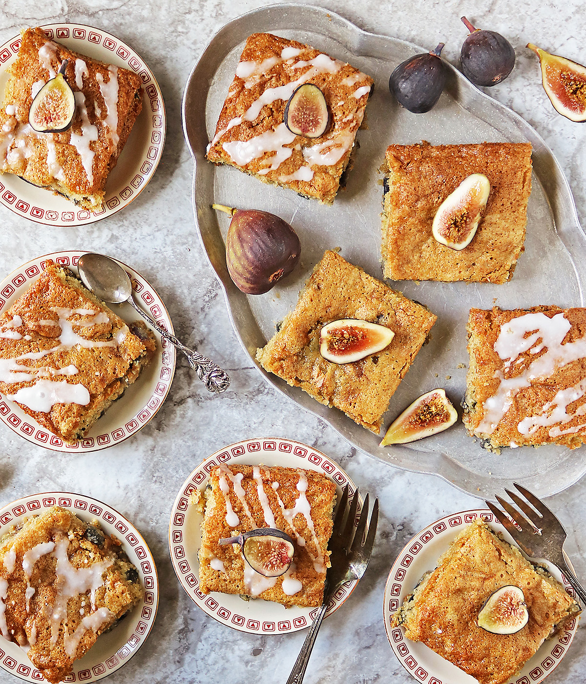 Tasty fig cake slices ready to be enjoyed on single serve plates.