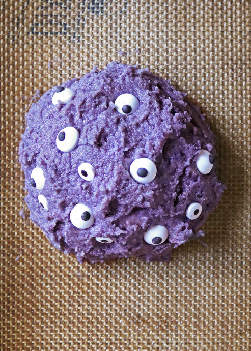 Adding eyes to purple sweet potato muffin tops