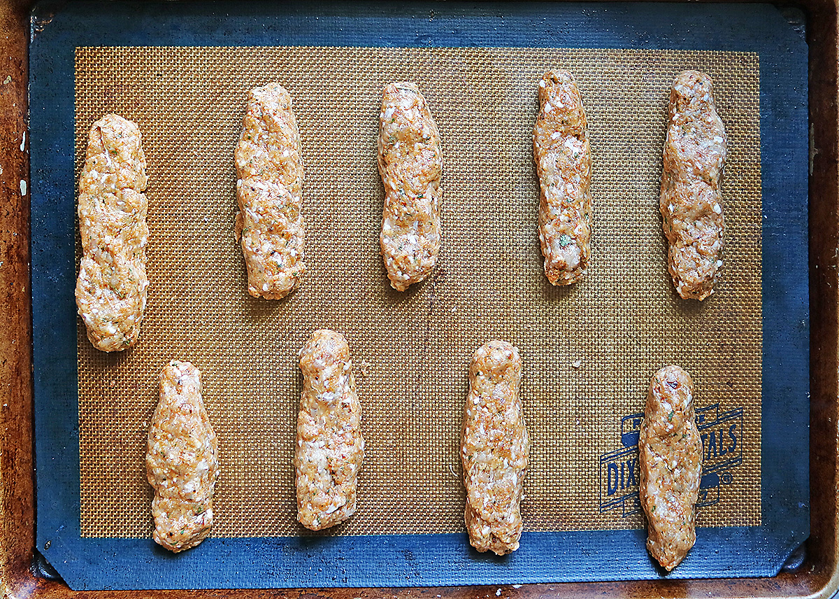 Shaping the chicken into fingers