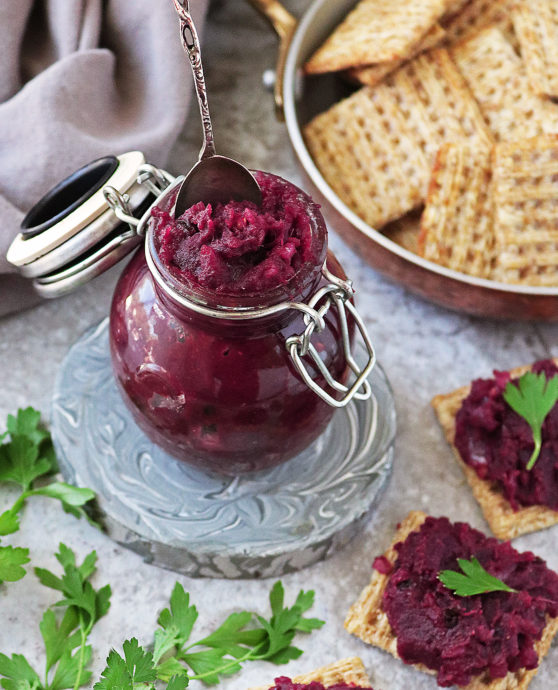 Easy purple sweet potato chutney in a small jar with crackers around.