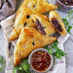 A paper-lined tray with The best Purple Sweet Potato Puffs.