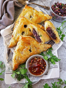 A paper-lined tray with The best Purple Sweet Potato Puffs.