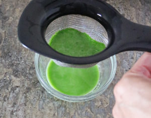 Straining the natural food coloring