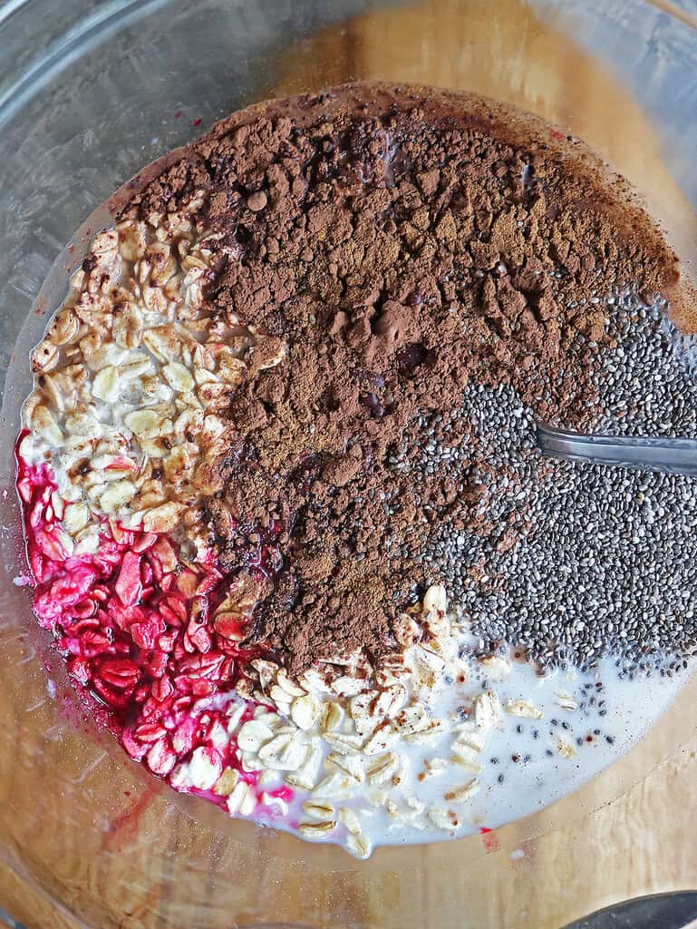 Mixing the ongredients for this naturally red overnight oats perfect for valentines day