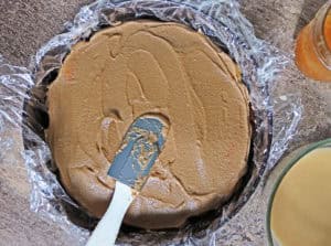 Layering chocolate mpusse over dulce de leche soaked ladyfingers 2