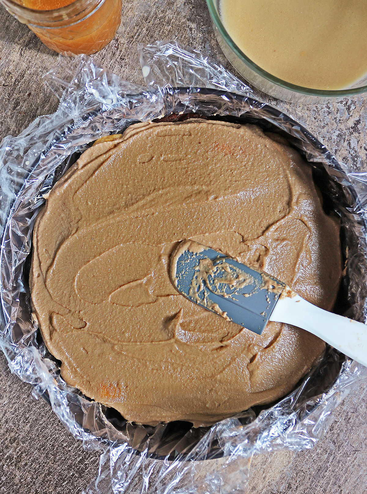 Layering chocolate mousse over dulce de leche soaked ladyfingers