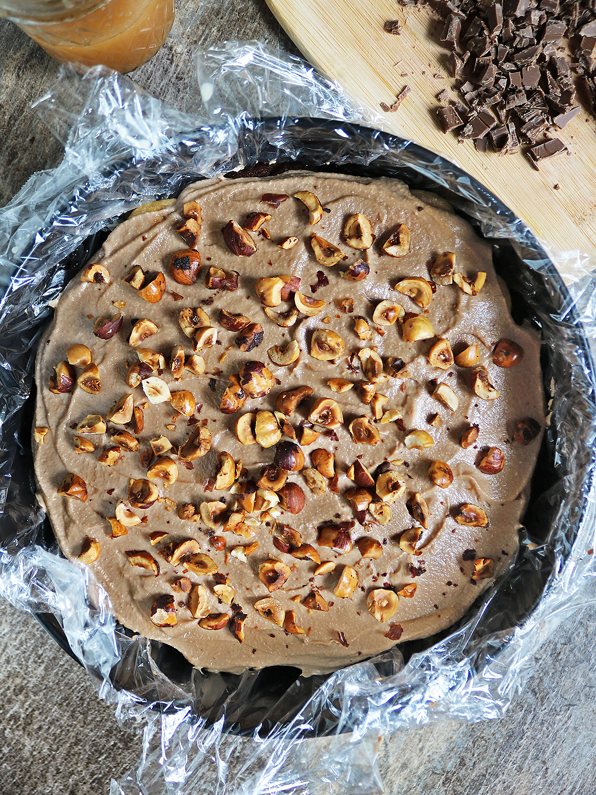 Layering hazelnuts over chocolate mousse over dulce de leche soaked ladyfingers 2