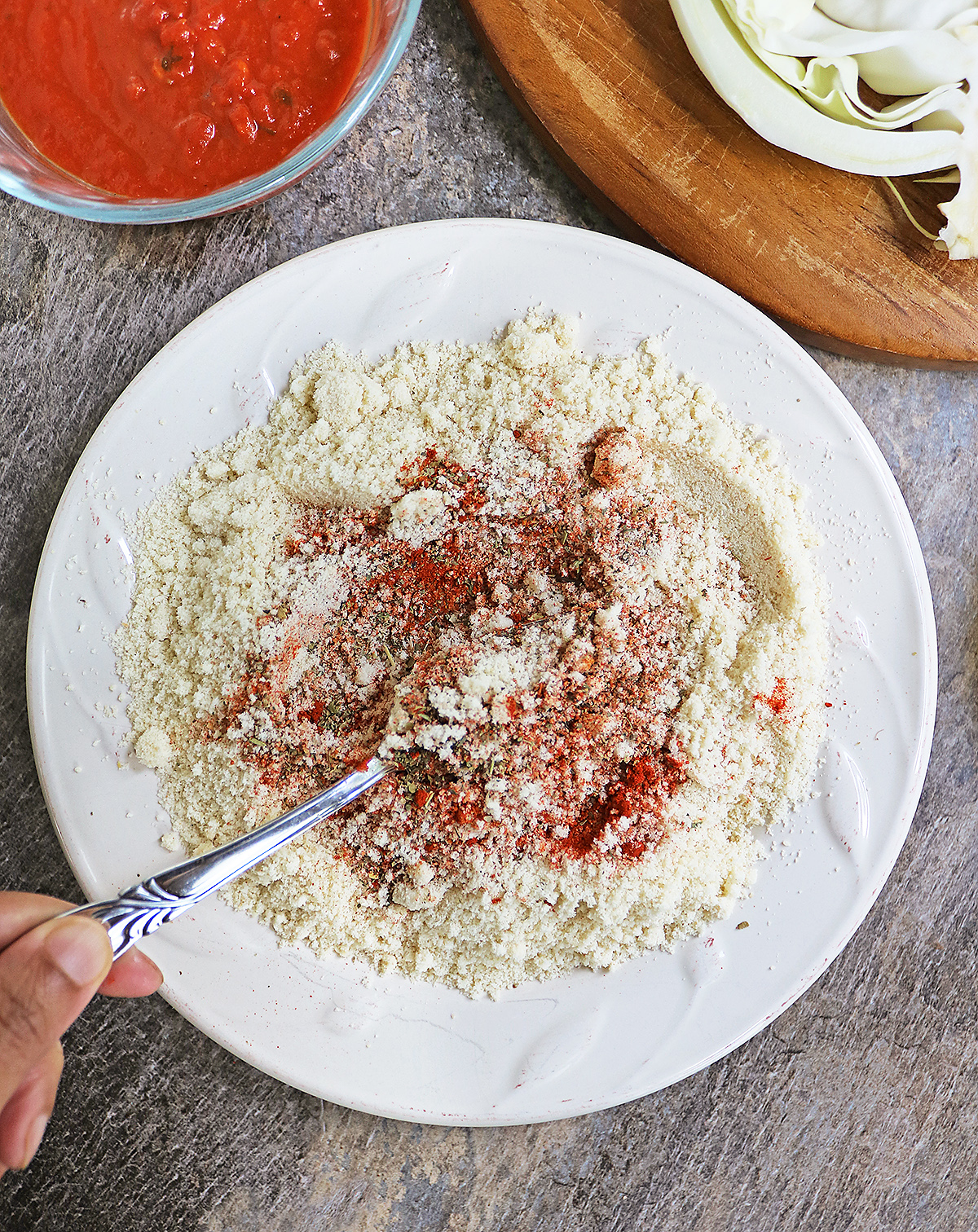Mixing the spices with the almond flour
