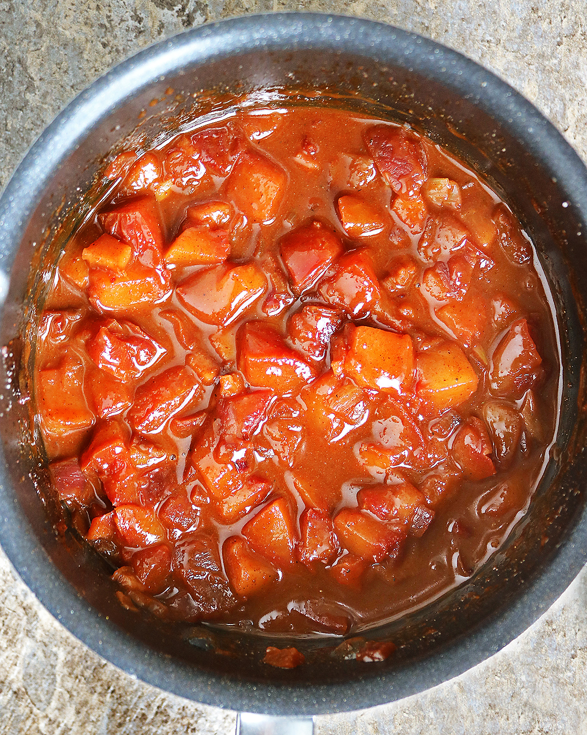 Simmering plums and other ingredients