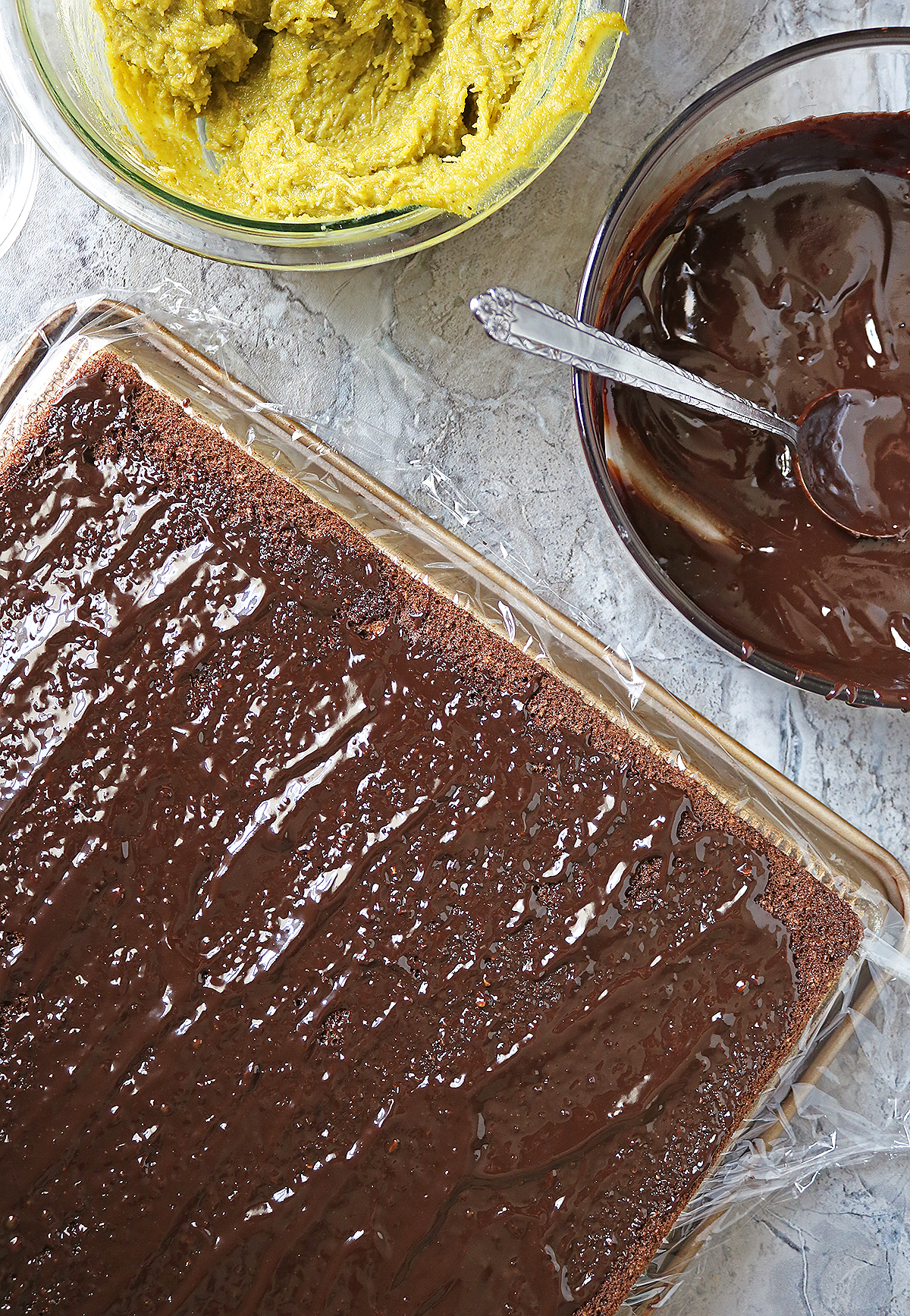 Adding a layer of chocolate ganache on to the oat chocolate base