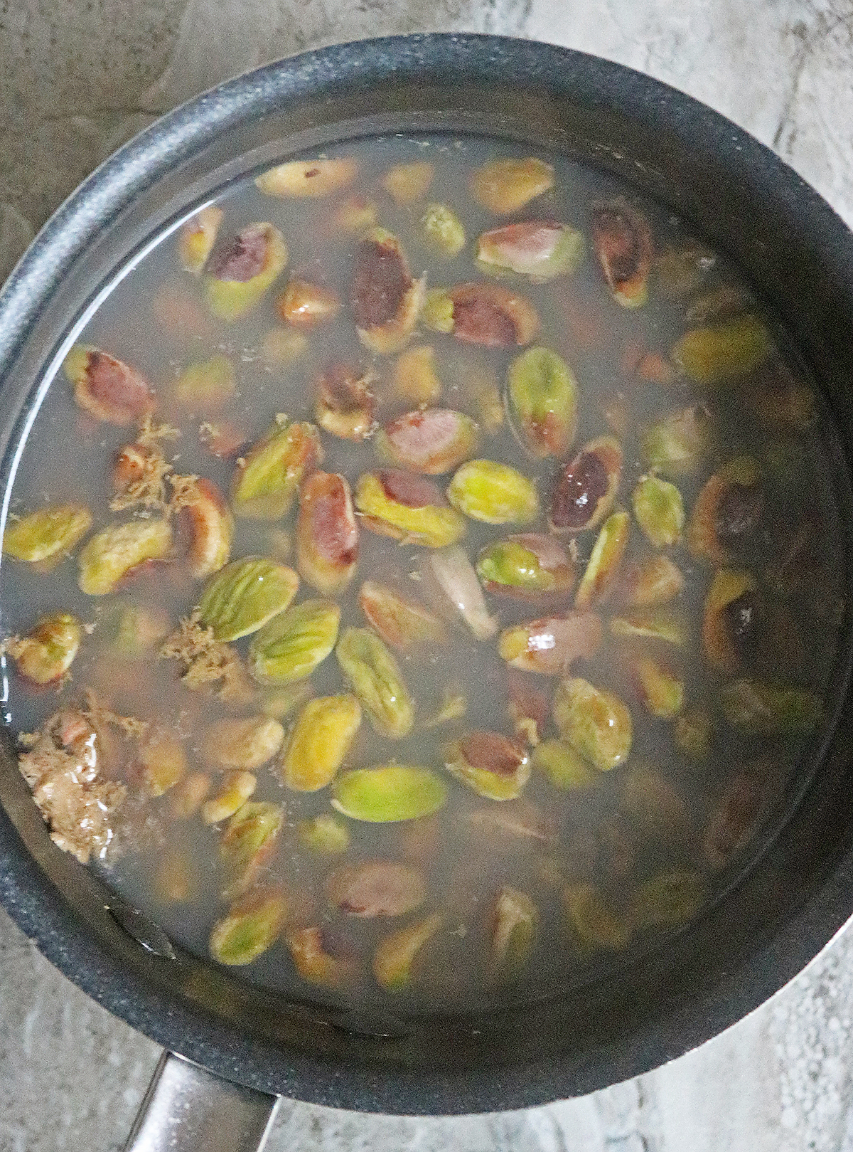 Adding pistachios to boiling water