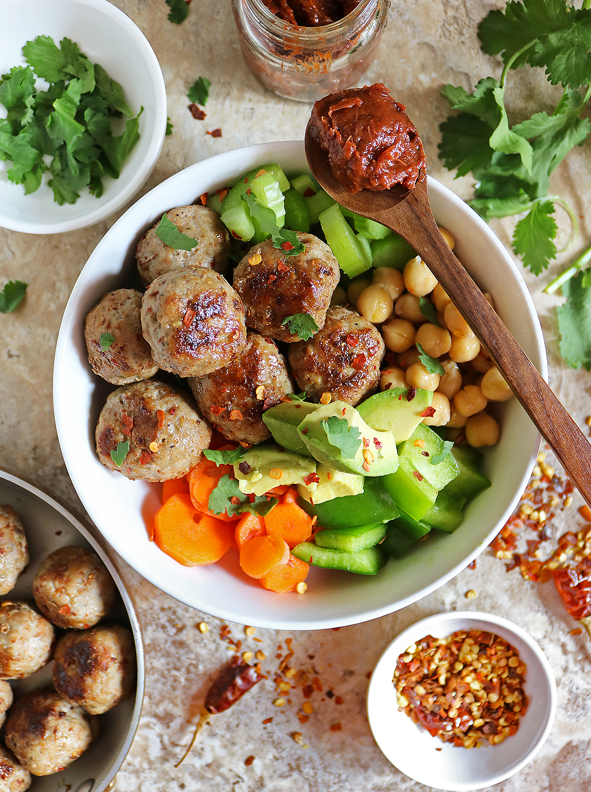 Easy za'atar turkeyballs IN A BOWL with fresh vegetables and rhubarb chutney.