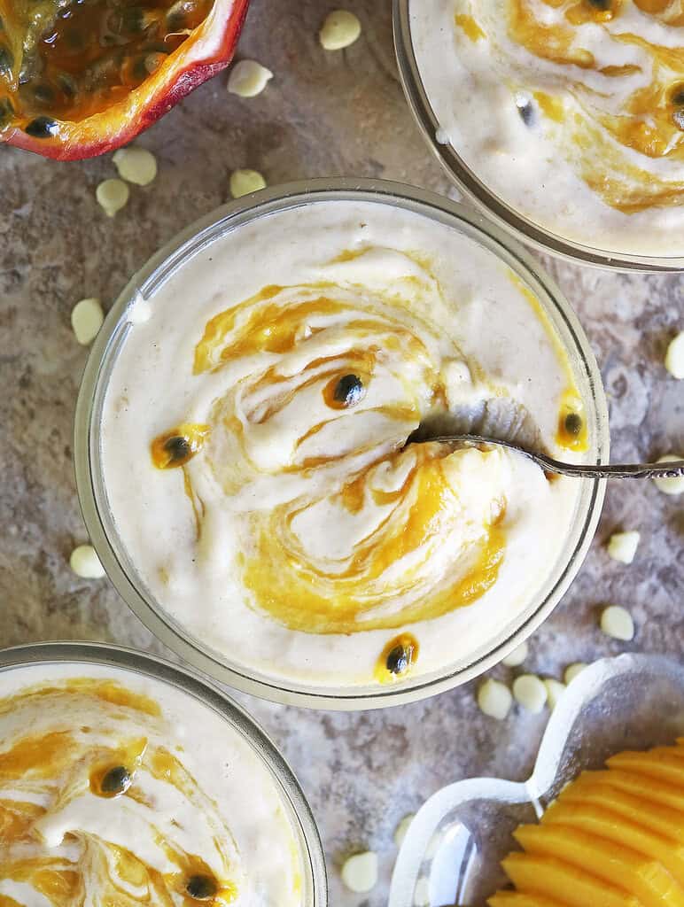 Enjoying a spoonful of this luscious rich passionfruit mango mousse made without any eggs or heavy cream.