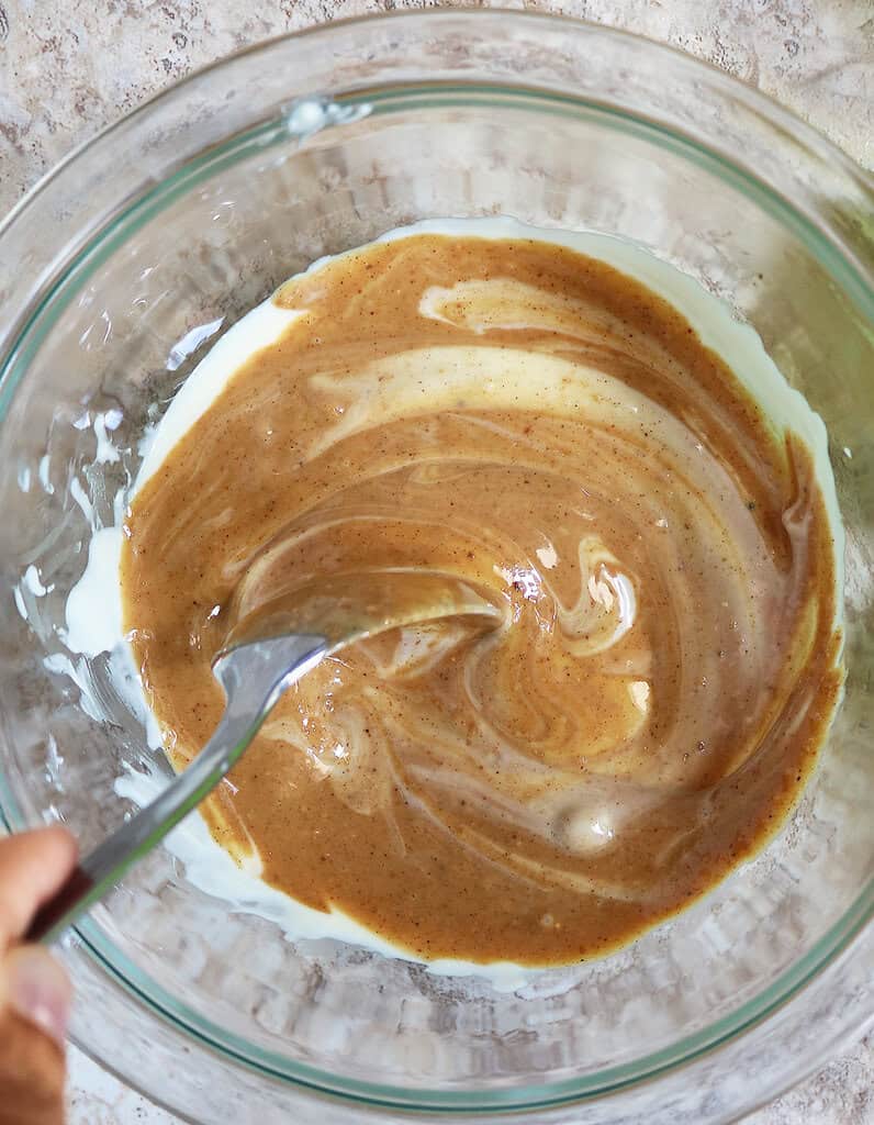 Mixing together melted chocolate and peanut butter