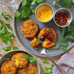 Air fried Easy green pea patties on a plate, with a fork near.