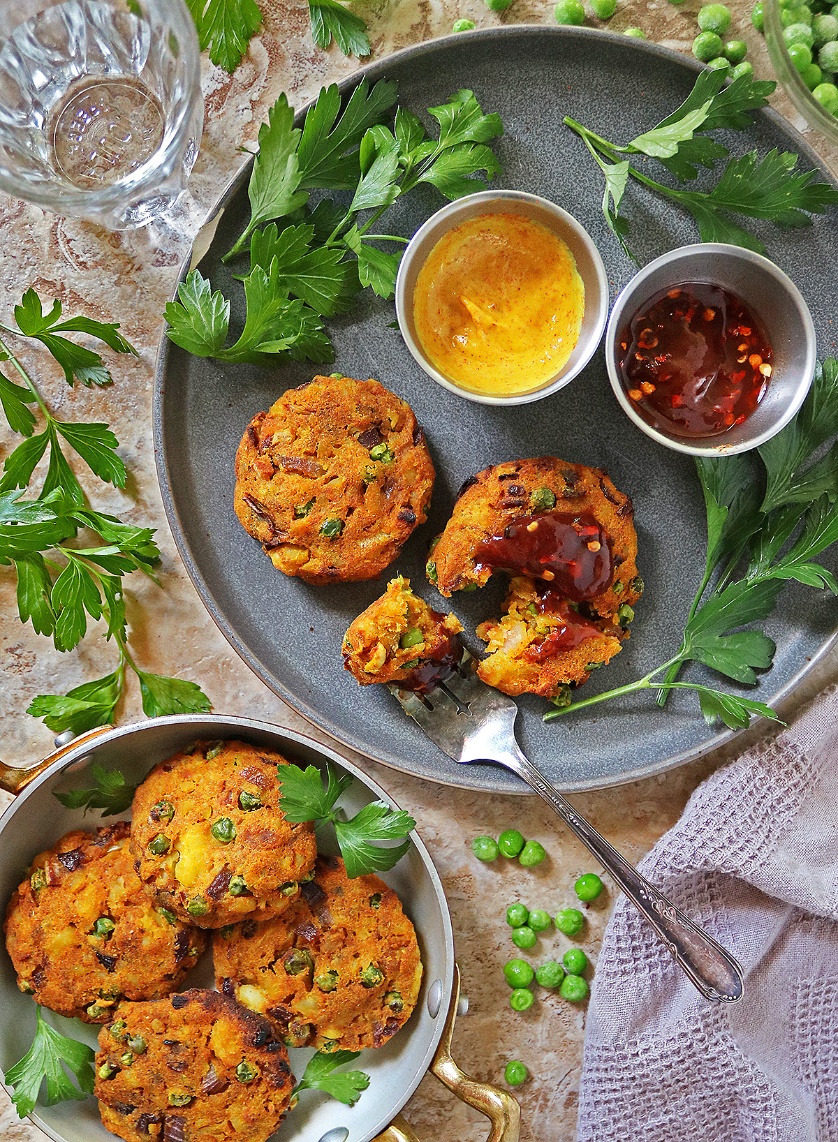 Air fried Easy green pea patties on a plate, with a fork near.