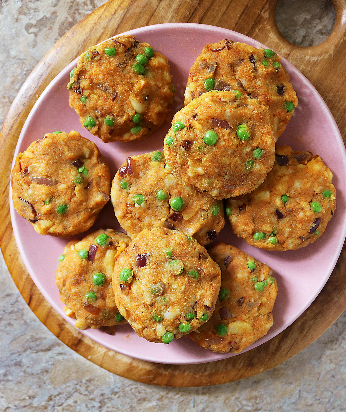 forming the spiced potato and green pea mixture into patties