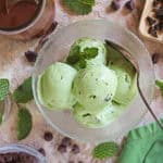 Dairy-free ninja creami mint chocolate chip ice cream with homemade chocolate hardshell by it.