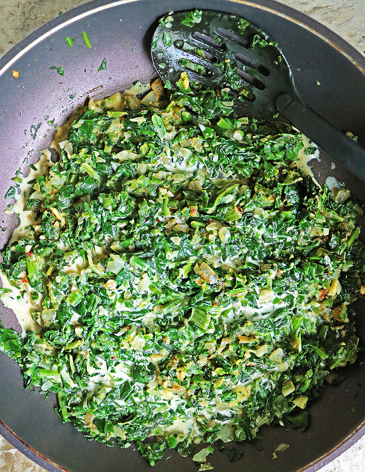Cooking delicious vegan creamed spinach