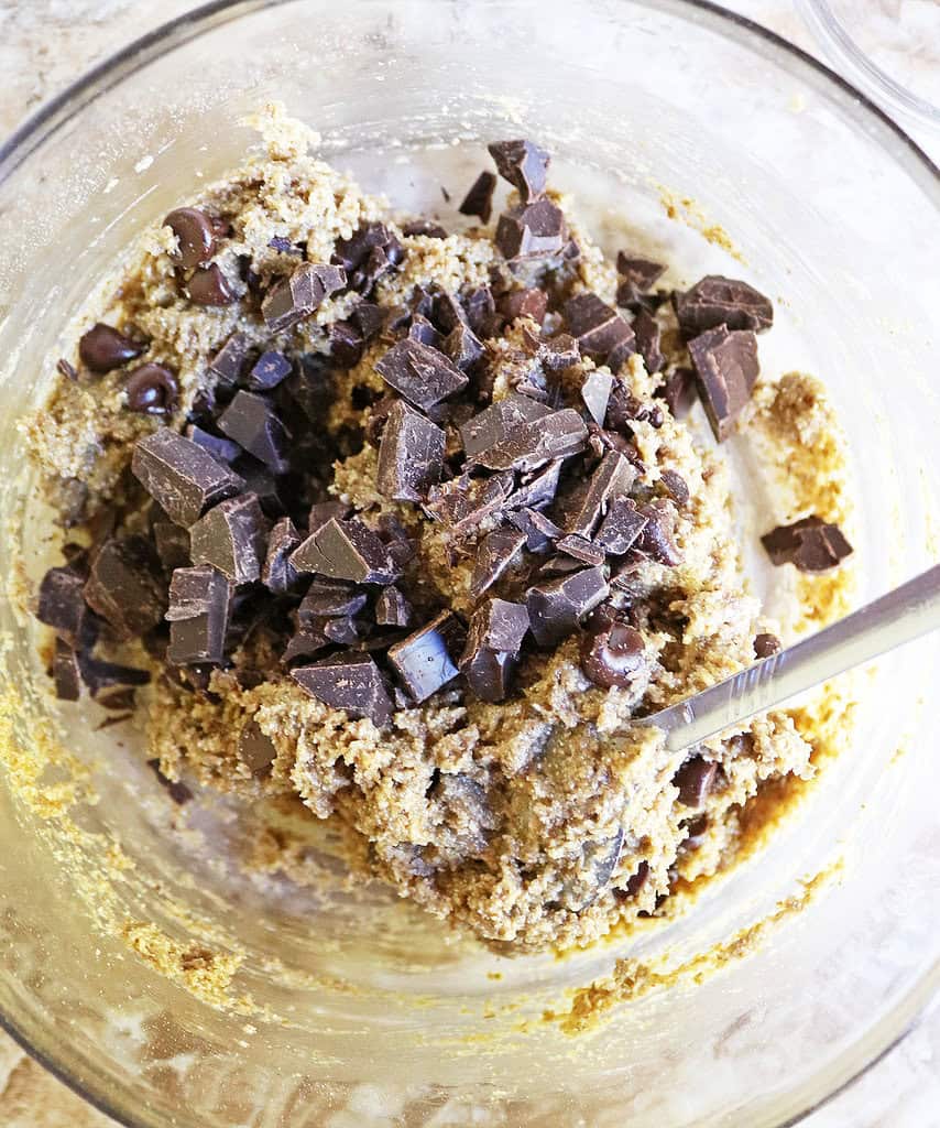 Mixing the chocolate into the muffin top mixture.