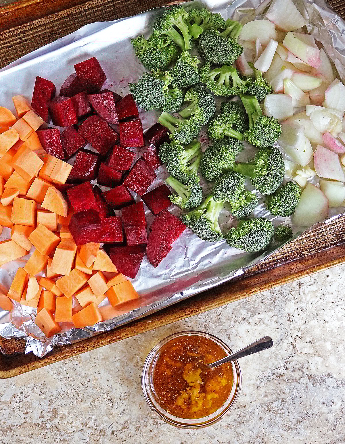 Vegetables prepped to be brushed with harissa garlic oil