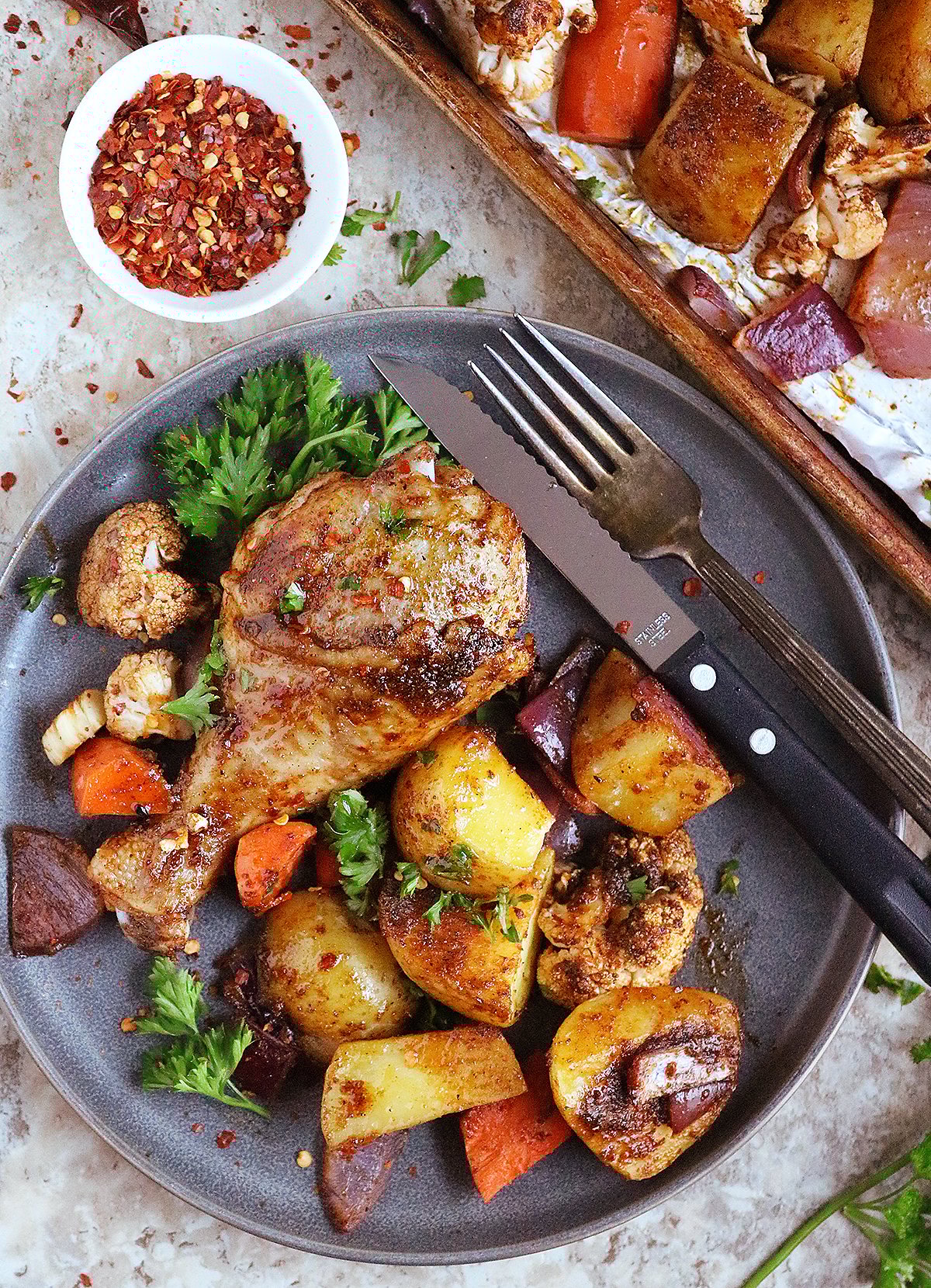 A plateful of The best spicy roasted chicken and vegetables