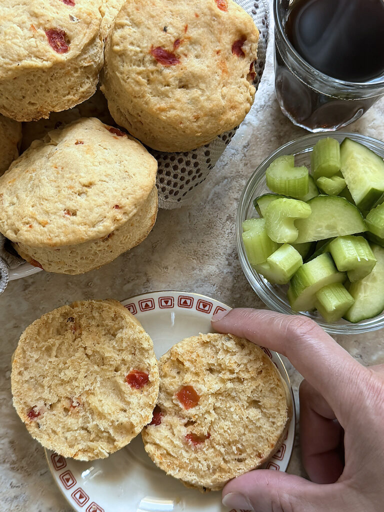 4 ingredient hummus biscuits on a plate with one cut open on another plate