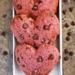 Easy Beet Chocolate Chip Muffin Tops (Naturally Colored) on a white rectangular tray on a brown background.