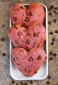 Easy Beet Chocolate Chip Muffin Tops (Naturally Colored) on a white rectangular tray on a brown background.