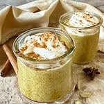 Two glass containers with Delicious Creamy Instant Golden Milk Chia Pudding