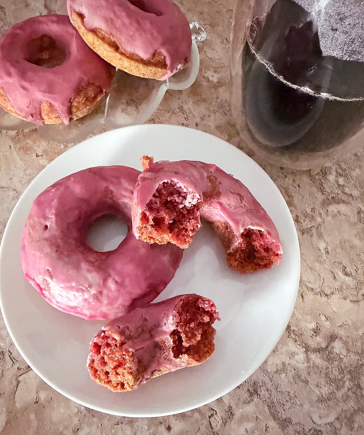 Delicious naturally colored pink donuts and coffee