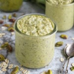 Easy pistachio overnight oats in 2 glass containers ready to be enjoyed.
