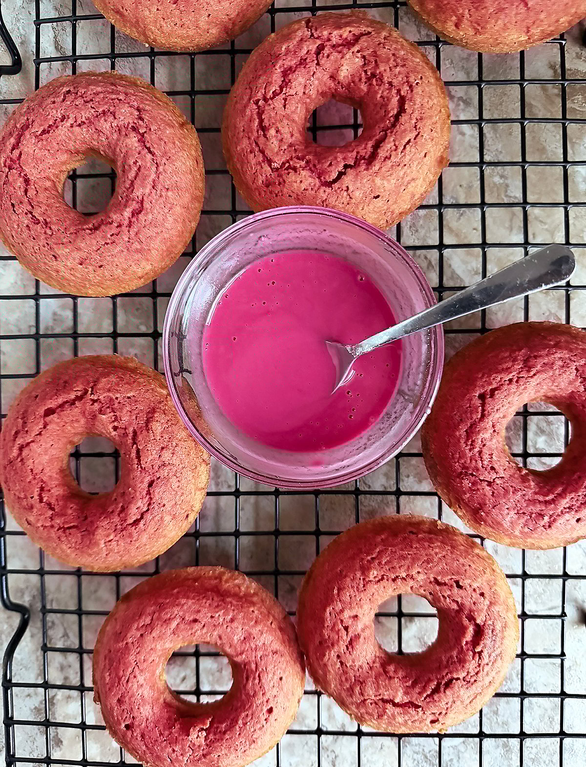 Small bowl with glaze made without food coloring to drizzle over donuts