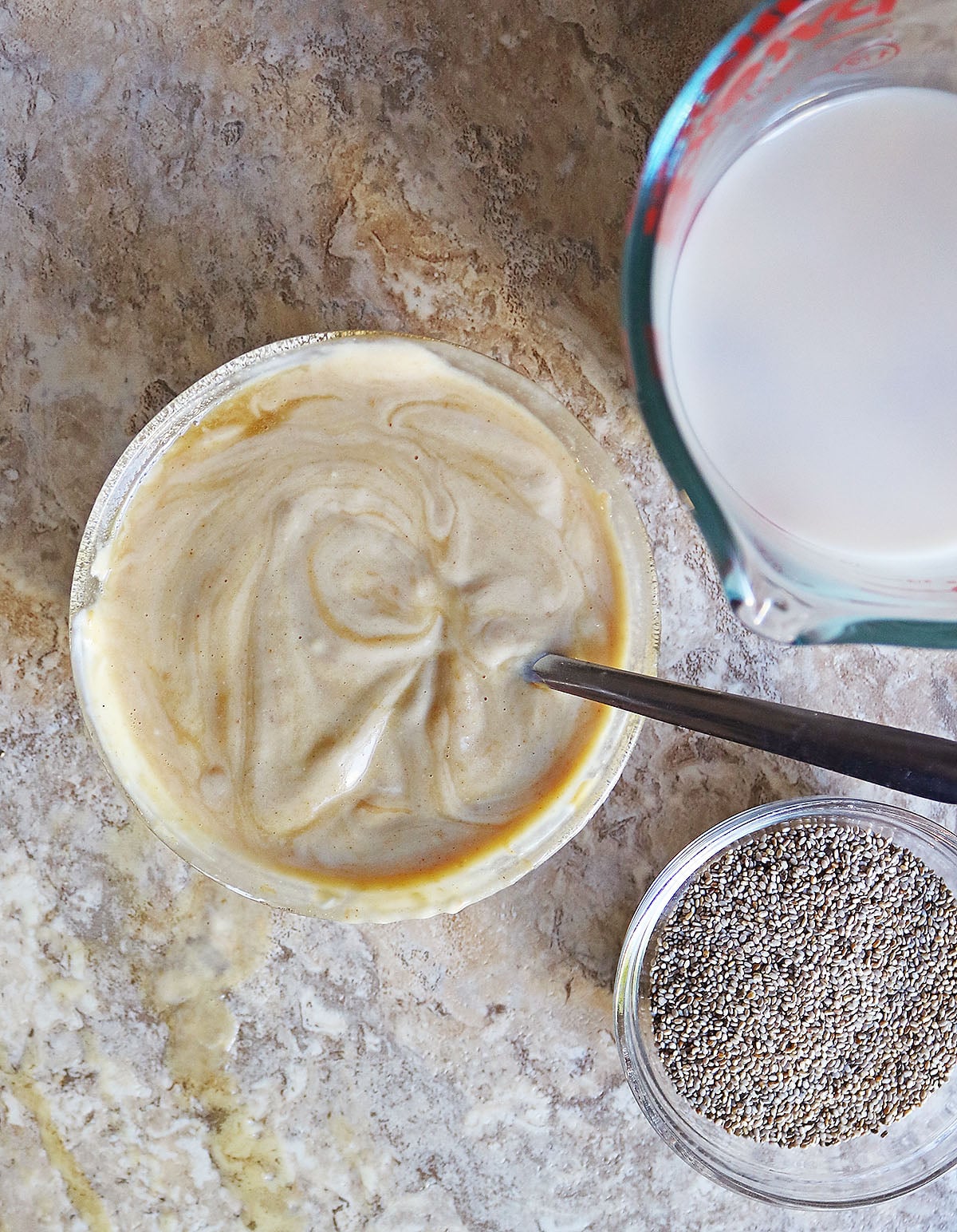 mixing together the yogurt, maple syrup and peanut butter