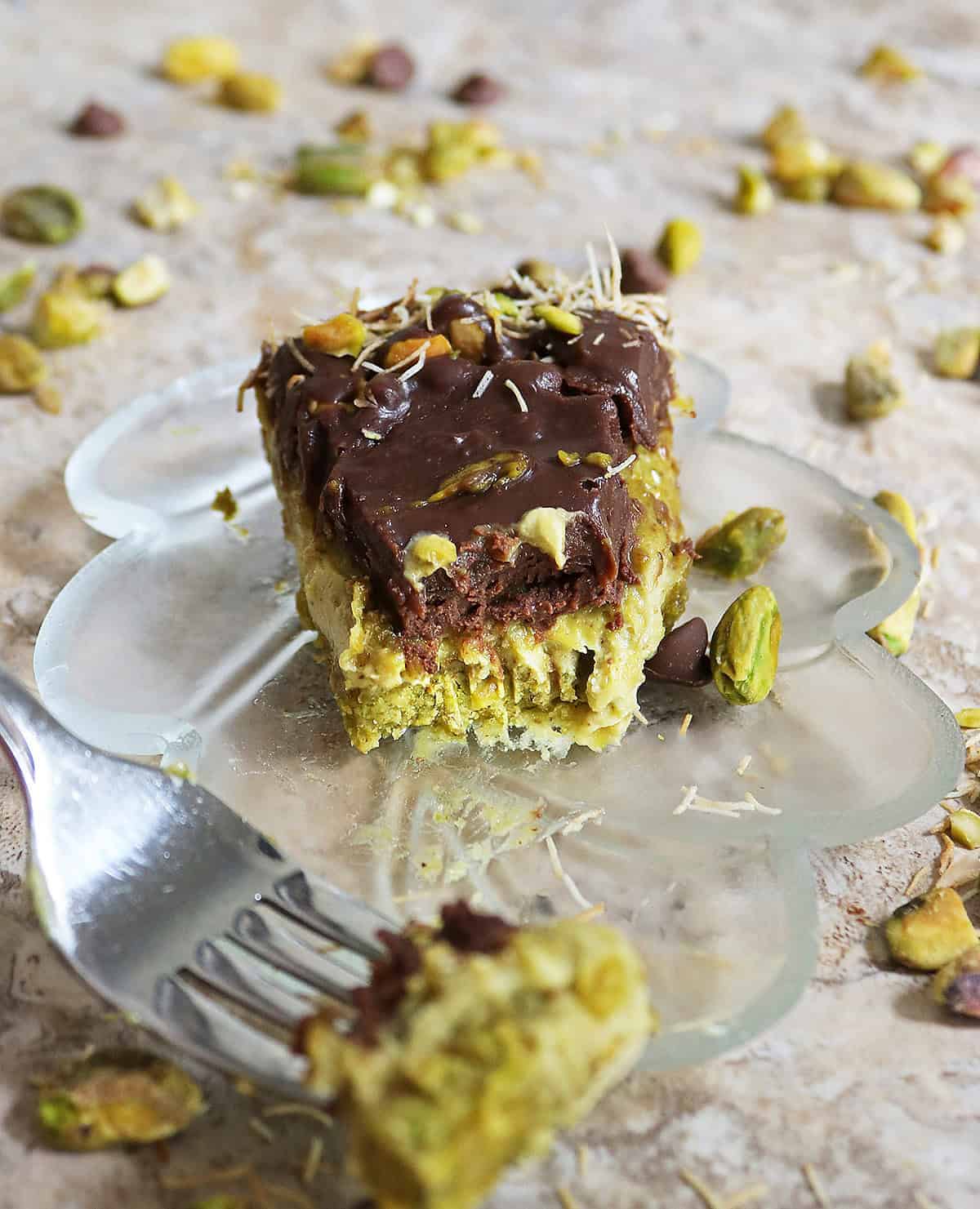 A bite of a slice of Dairy-free no bake Dubai chocolate cheesecake