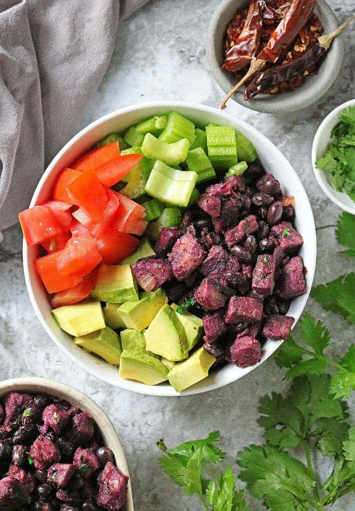 Spicy purple sweet potato and black bean bowls or tacos