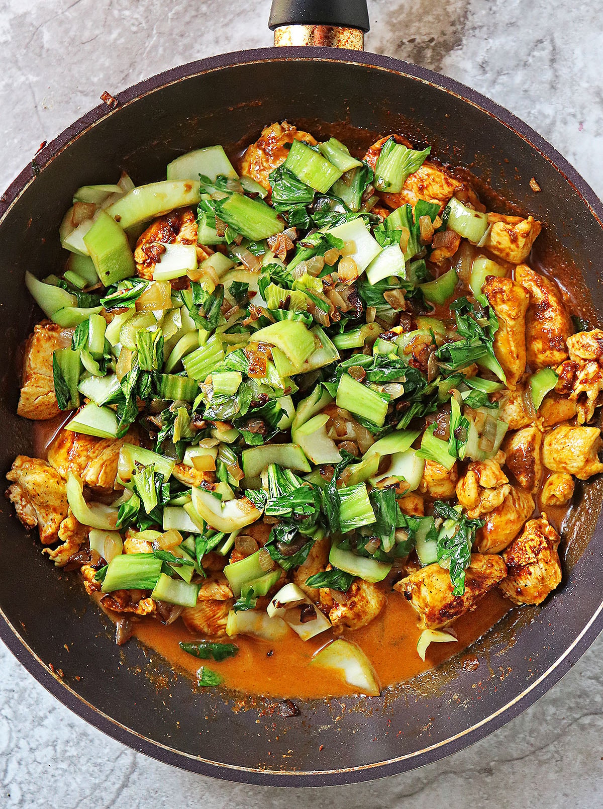 making chicken and bok choy dinner