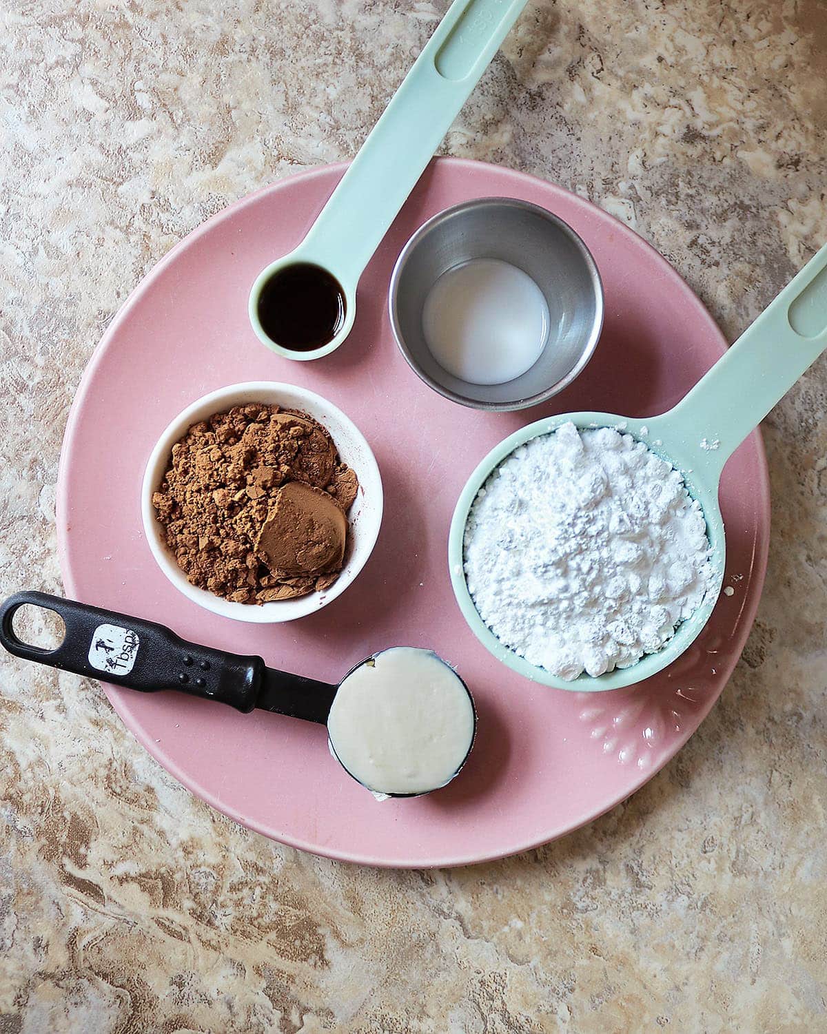 5 ingredients needed to make this easy, dairy-free chocolate frosting.