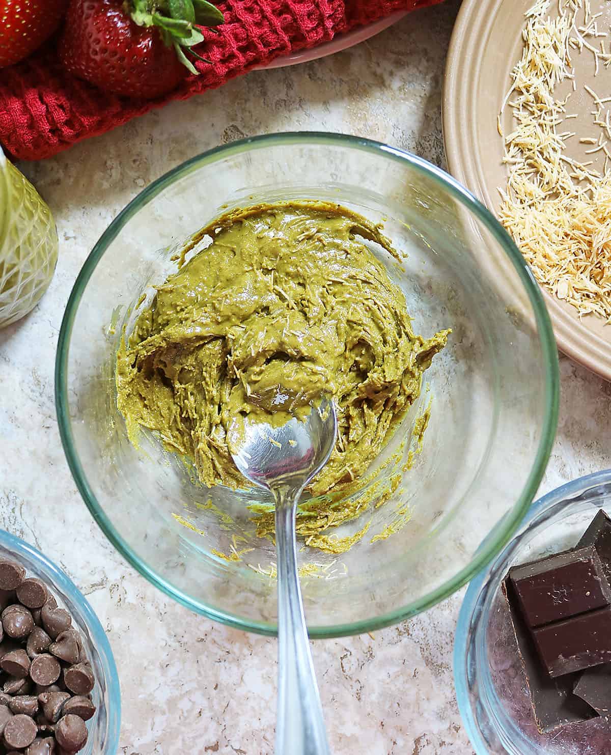 Mixing the pistachio butter and toasted kataifi